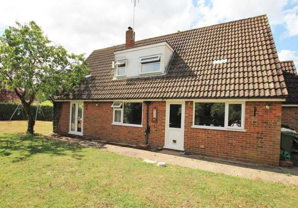 a brick house with a tiled roof